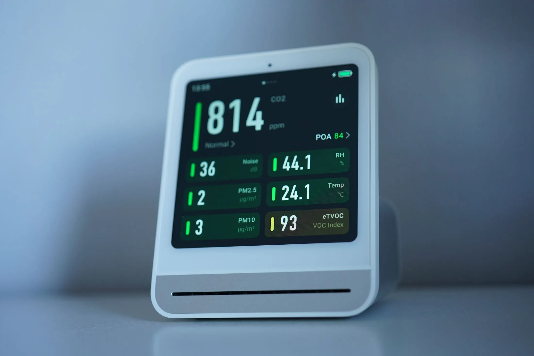Indoor air quality monitor showing live readings